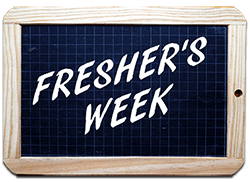freshers week written on a board